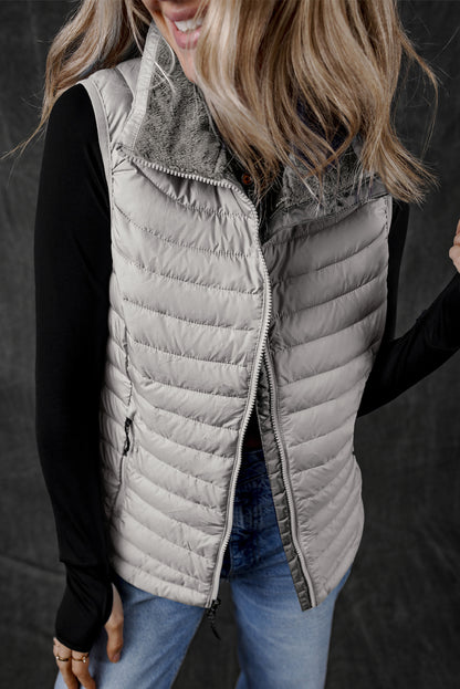 Silvery plush collared quilted zipped puffer vest with trendy puffer style and zip closure.