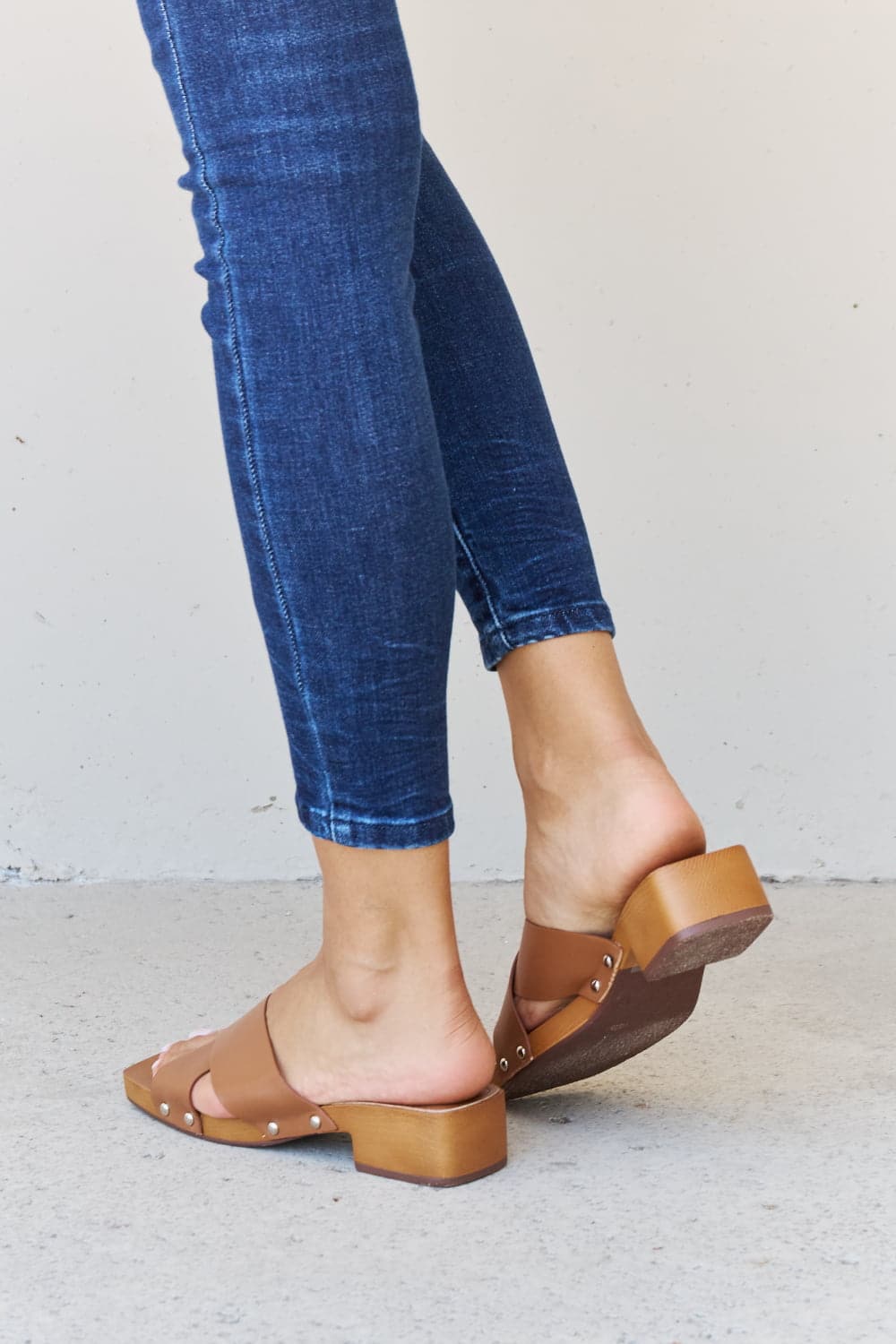 Weeboo Step Into Summer Criss Cross Wooden Clog Mule in Brown.