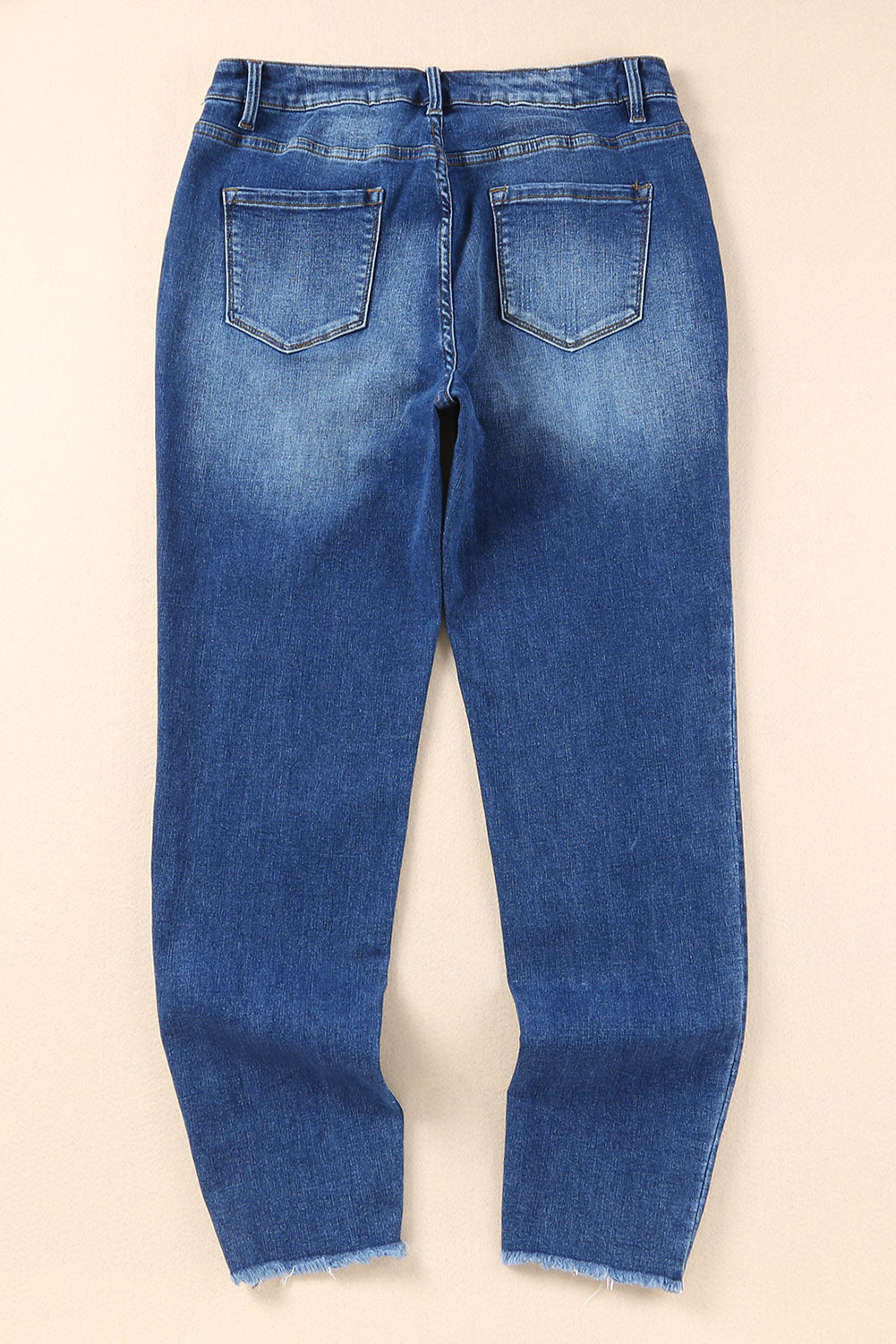 Chic blue ankle-length skinny jeans with raw hem detail