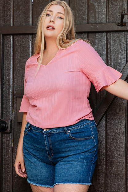 Peach blossom textured plus top with ruffled sleeves and V-neck