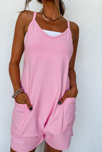 Chic pink sleeveless jersey romper with pockets and v-neck detail