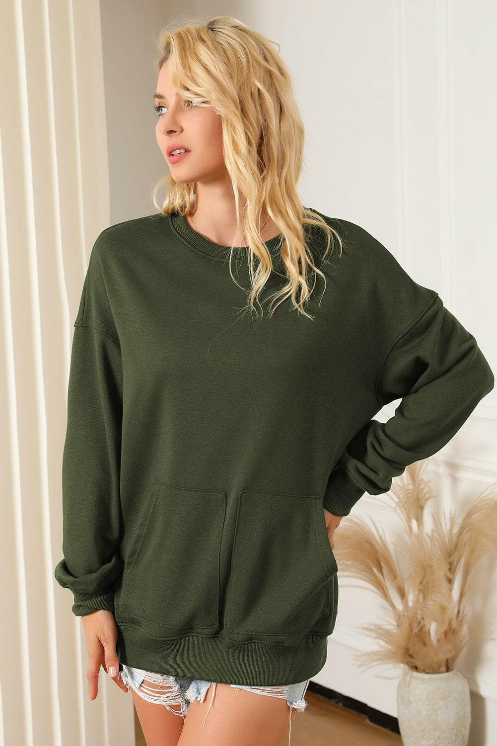 Pocketed Round Neck Dropped Shoulder Sweatshirt.