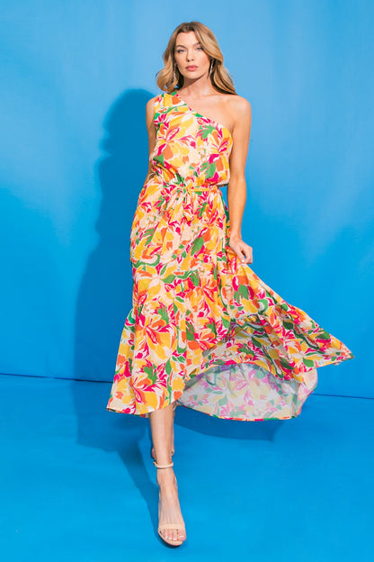 Floral one-shoulder hi-lo maxi dress with ruffled hem and self sash tie.