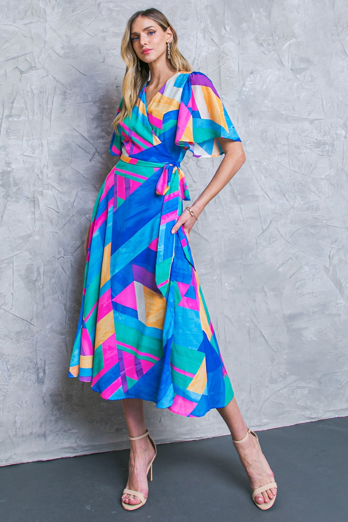 Colorful A-line wrap midi dress with flutter sleeves and side tie.