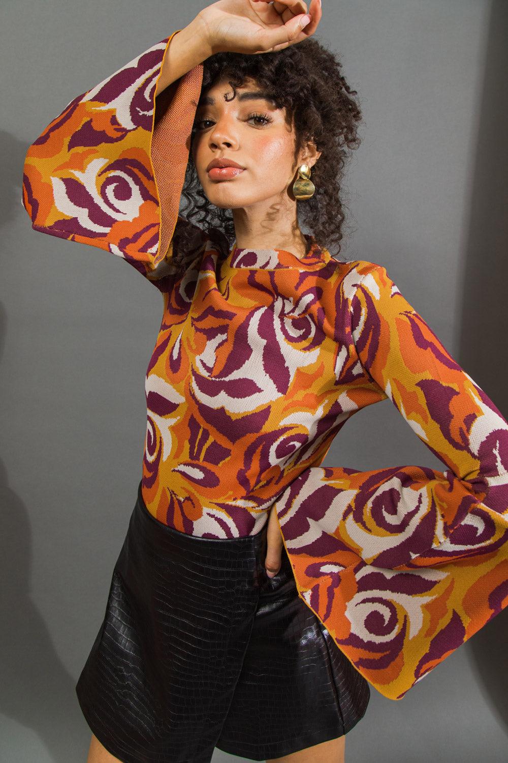 Flying Tomato HER FAVORITE FEATURES SWEATER TOP worn by a model, illustrating its flattering silhouette and comfortable, rela