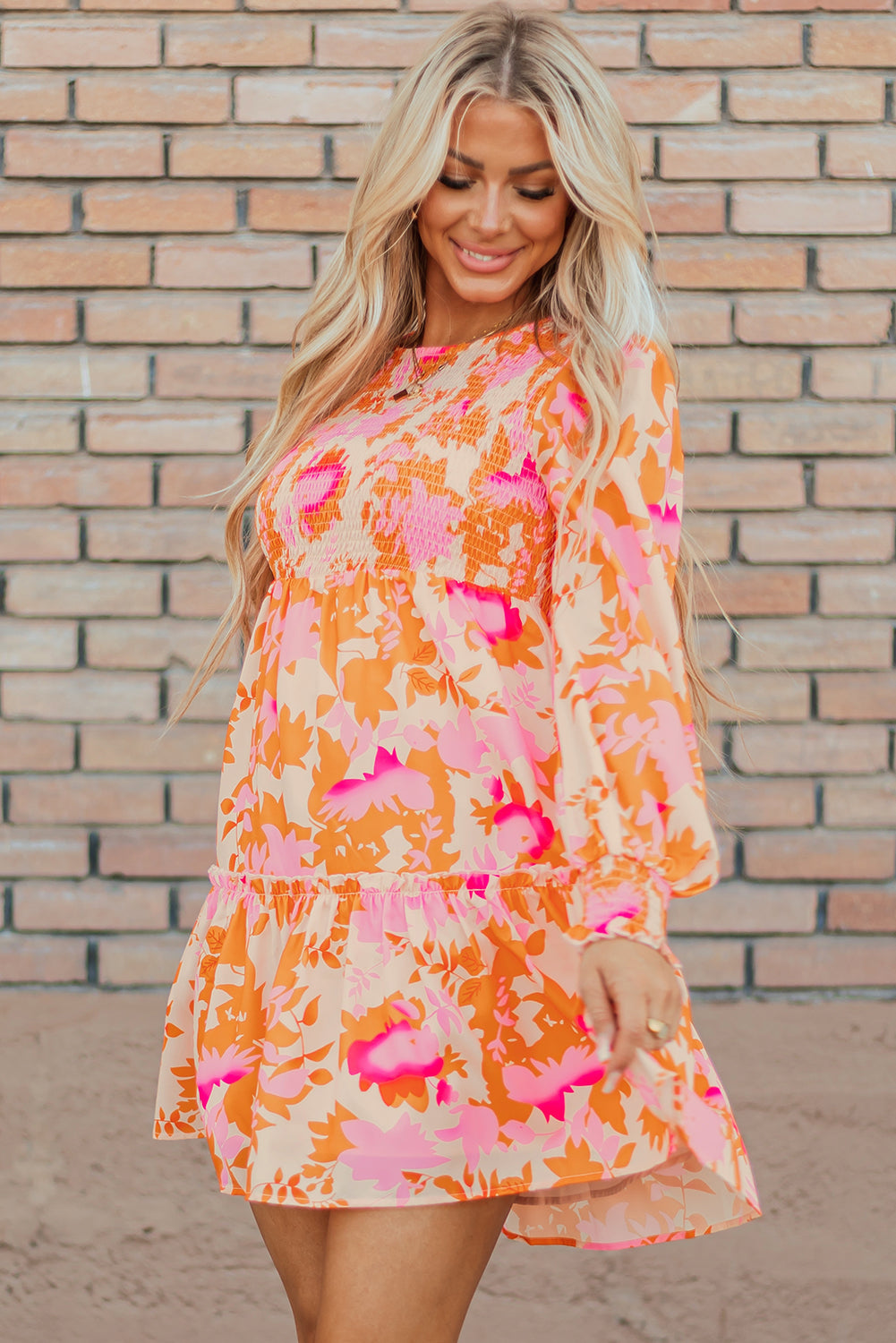 Eye-catching orange abstract smocked mini dress with ruffled lantern sleeves