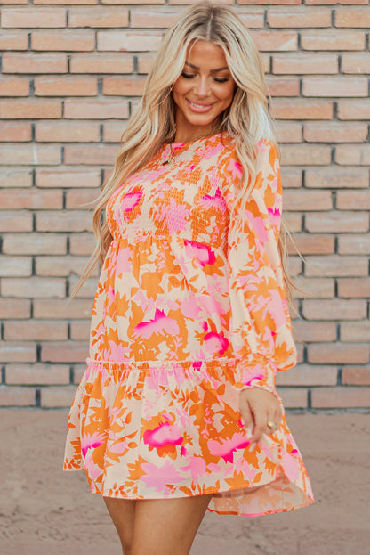 Eye-catching orange abstract smocked mini dress with ruffled lantern sleeves