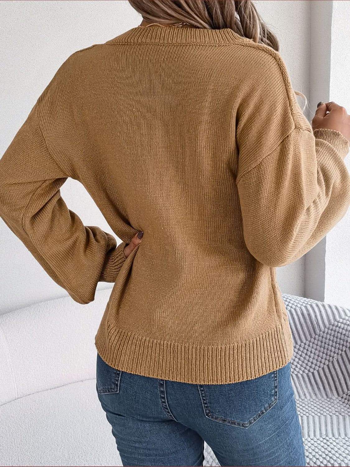 Cable-Knit Buttoned V-Neck Sweater.