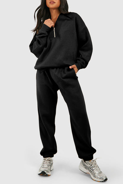 Chic black half zip tracksuit with ribbed edges for ultimate comfort