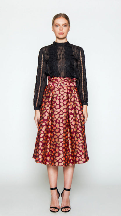 Club midi skirt with chic cheetah print, high paper-bag waist, and elegant pleats.