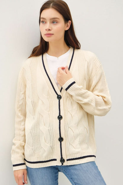 Cool contrast trim cable-knit V-neck cardigan with buttoned design.