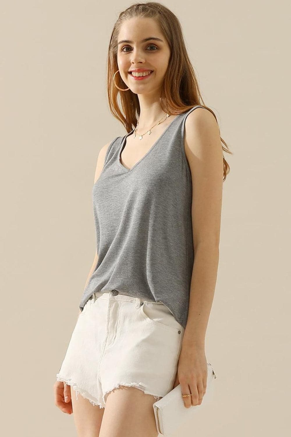 Ninexis Full Size V-Neck Curved Hem Tank.