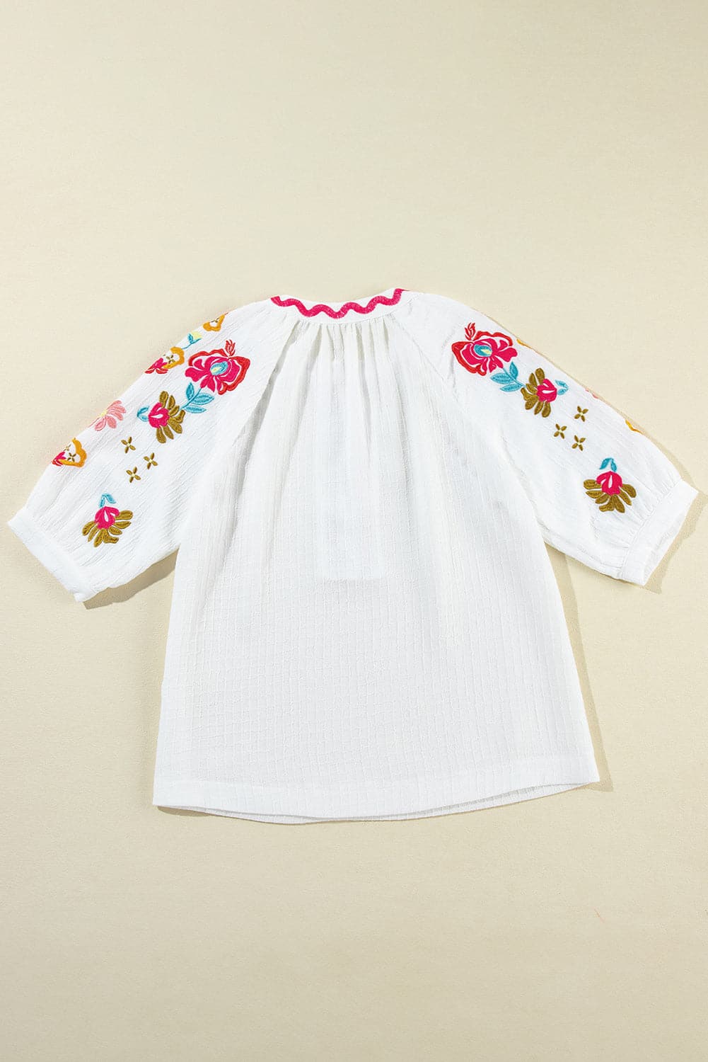 Embroidered Notched Half Sleeve Blouse.