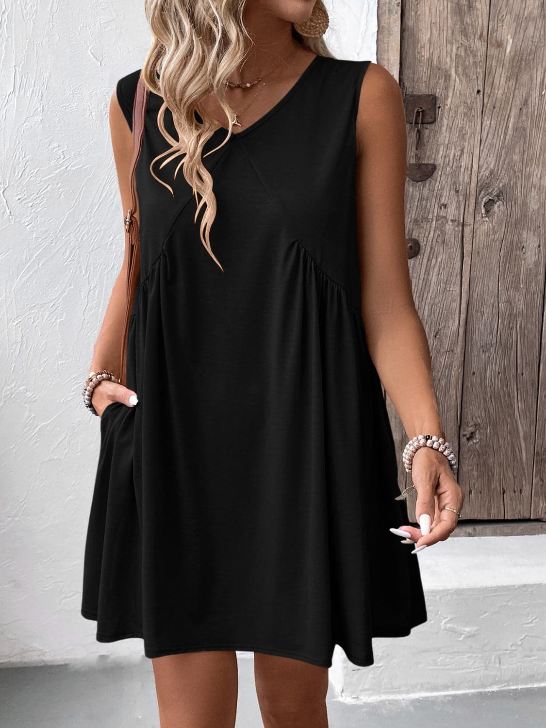 Ruched V-Neck Sleeveless Mini Dress.