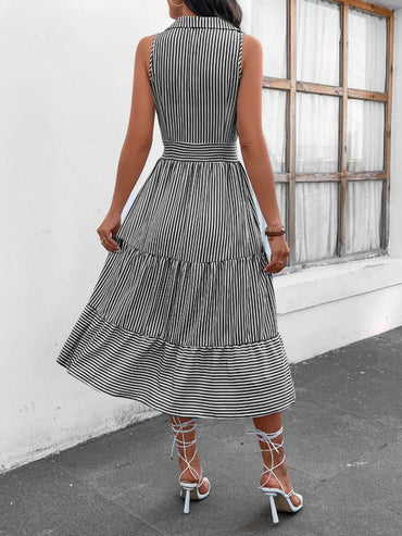 Chic striped midi dress with collar and decorative buttons.