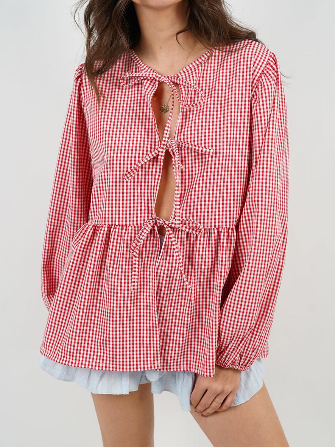 Tied Round Neck Long Sleeve Blouse.