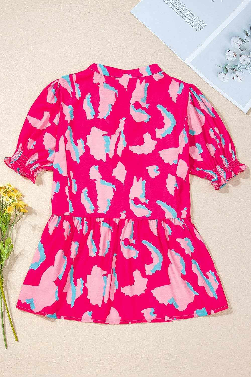 Peplum Printed Notched Short Sleeve Blouse.