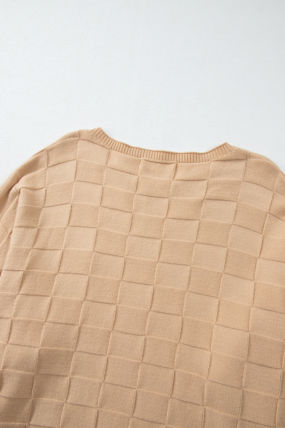 Cozy elegance: Light beige checkered textured knit sweater in plus sizes