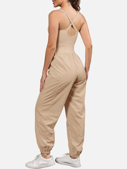 Chic cutout scoop neck jumpsuit with wide straps and pockets