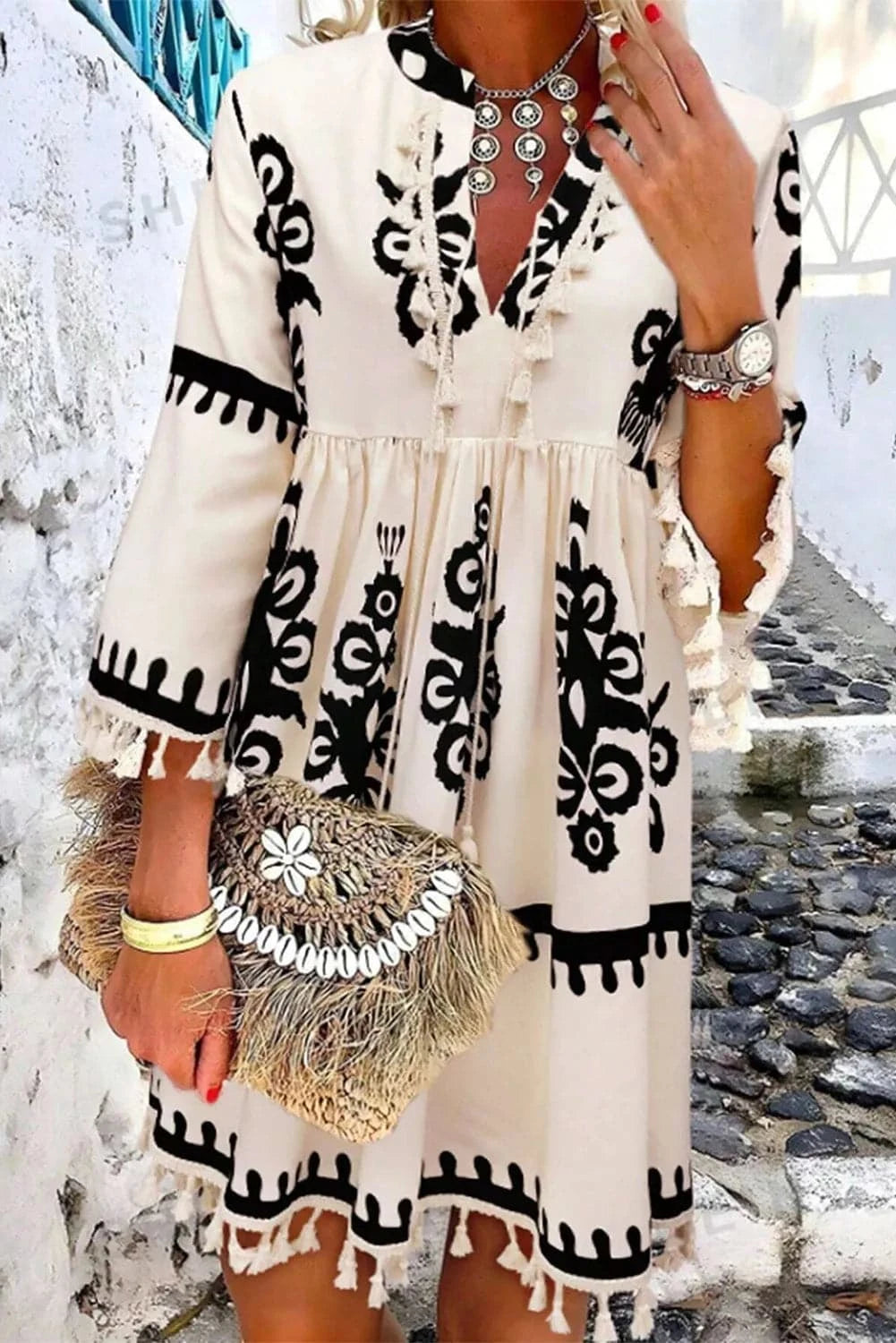 Bohemian tassel mini dress with three-quarter sleeves