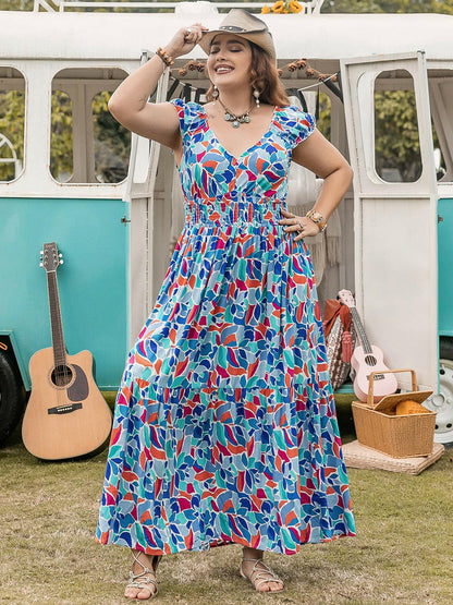 Vibrant plus size cap sleeve dress with colorful print, perfect for casual and elegant events.