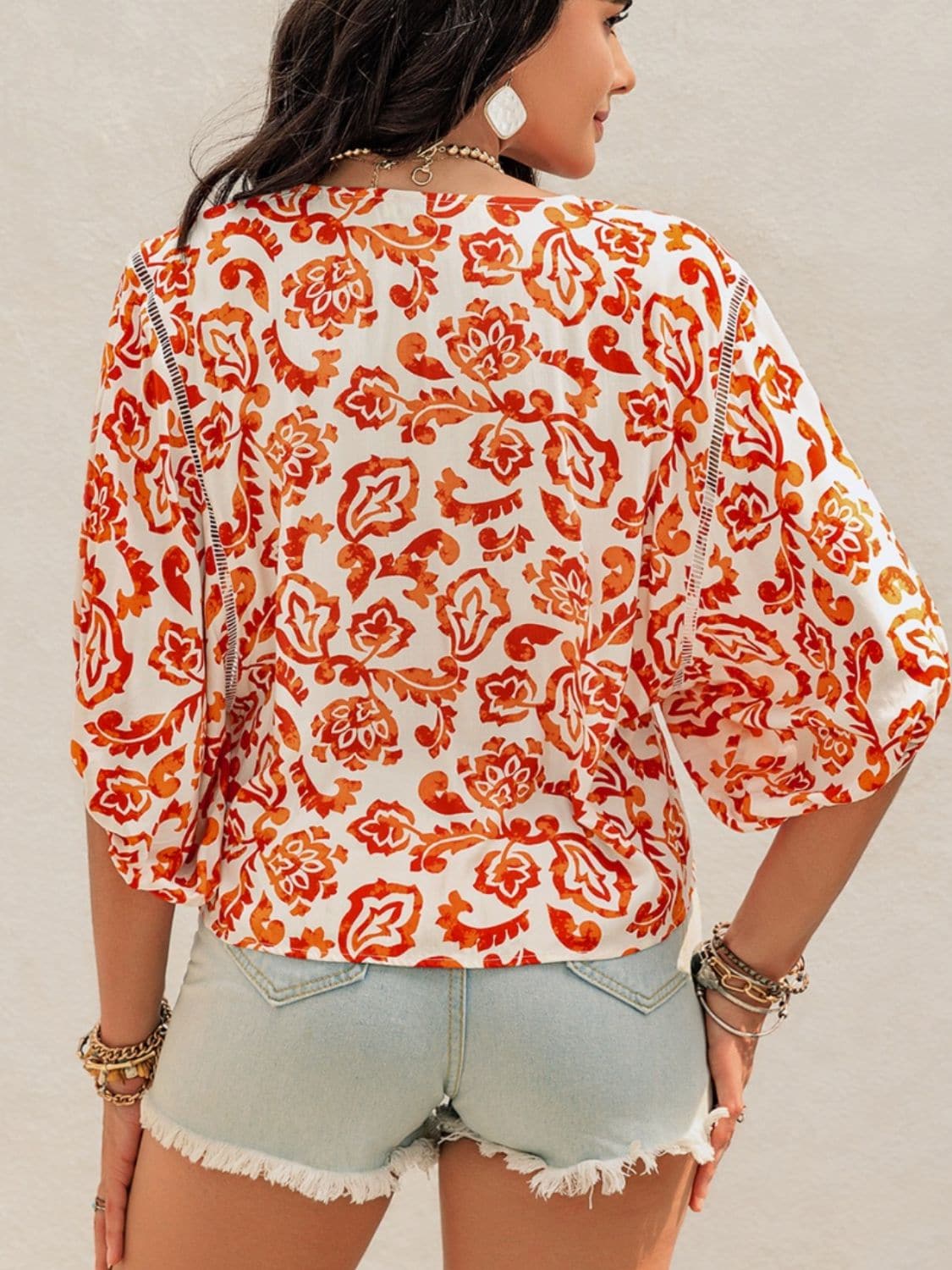 Chic sheer-cut blouse with elegant printed design