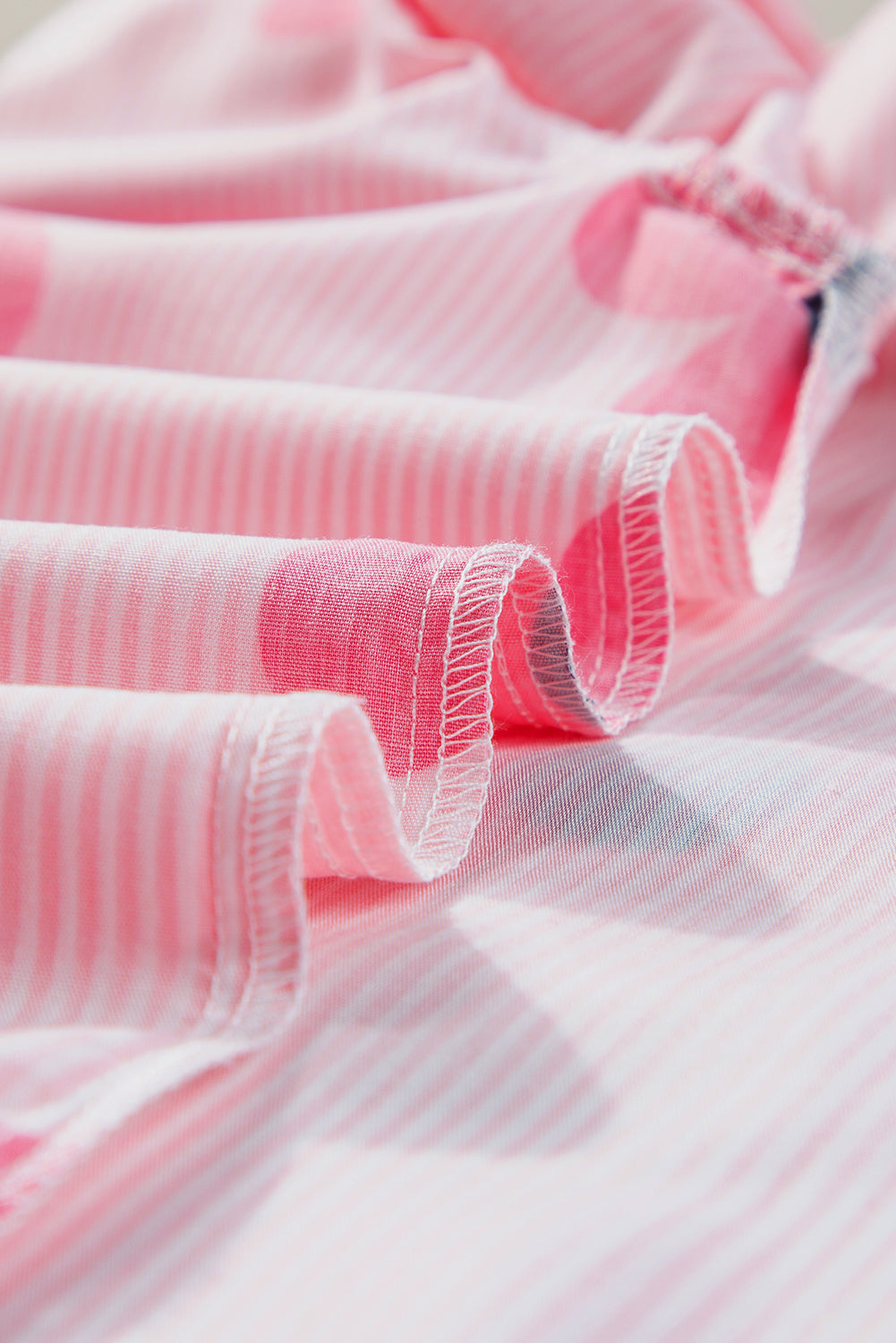 Chic pink pinstripe floral blouse with ruffled flutter sleeves