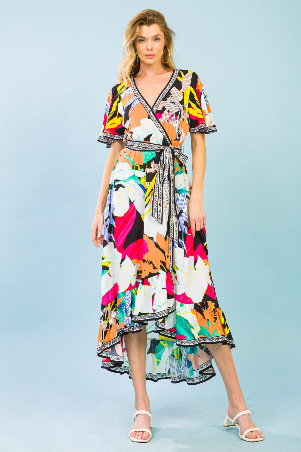 Dancing floral midi dress with surplice neckline, fluttered sleeves, elasticized waist, self-sash tie, and ruffled hemline.