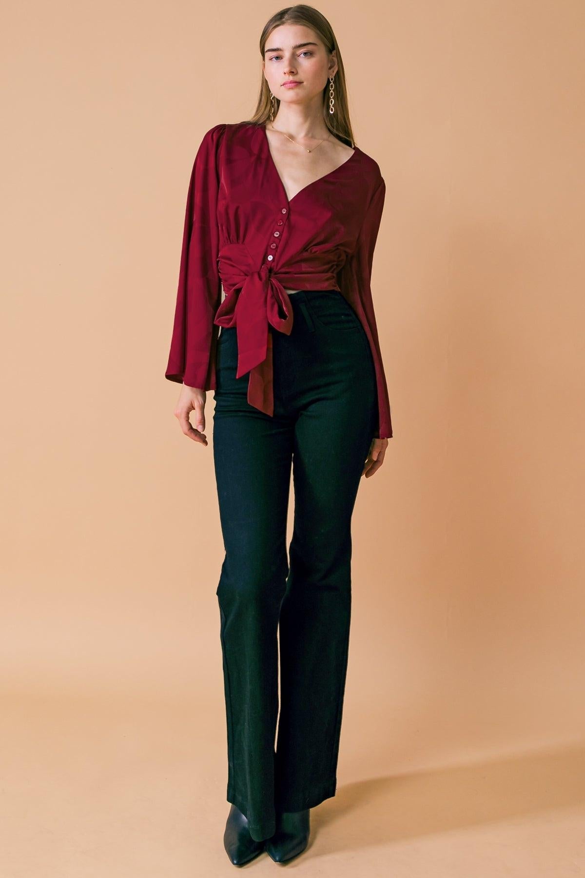 Detail of the stylish neckline on Flying Tomato THE RIGHT ADDITION WOVEN TOP, emphasizing its refined craftsmanship.