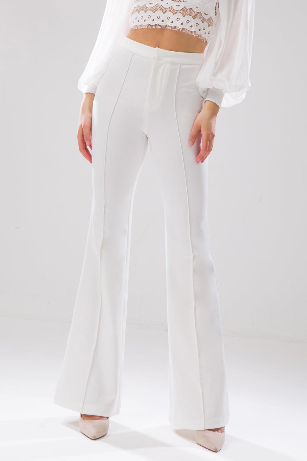 Close-up of Flying Tomato BUT BETTER FLARE PANTS fabric, revealing the premium denim texture and detailed stitching.
