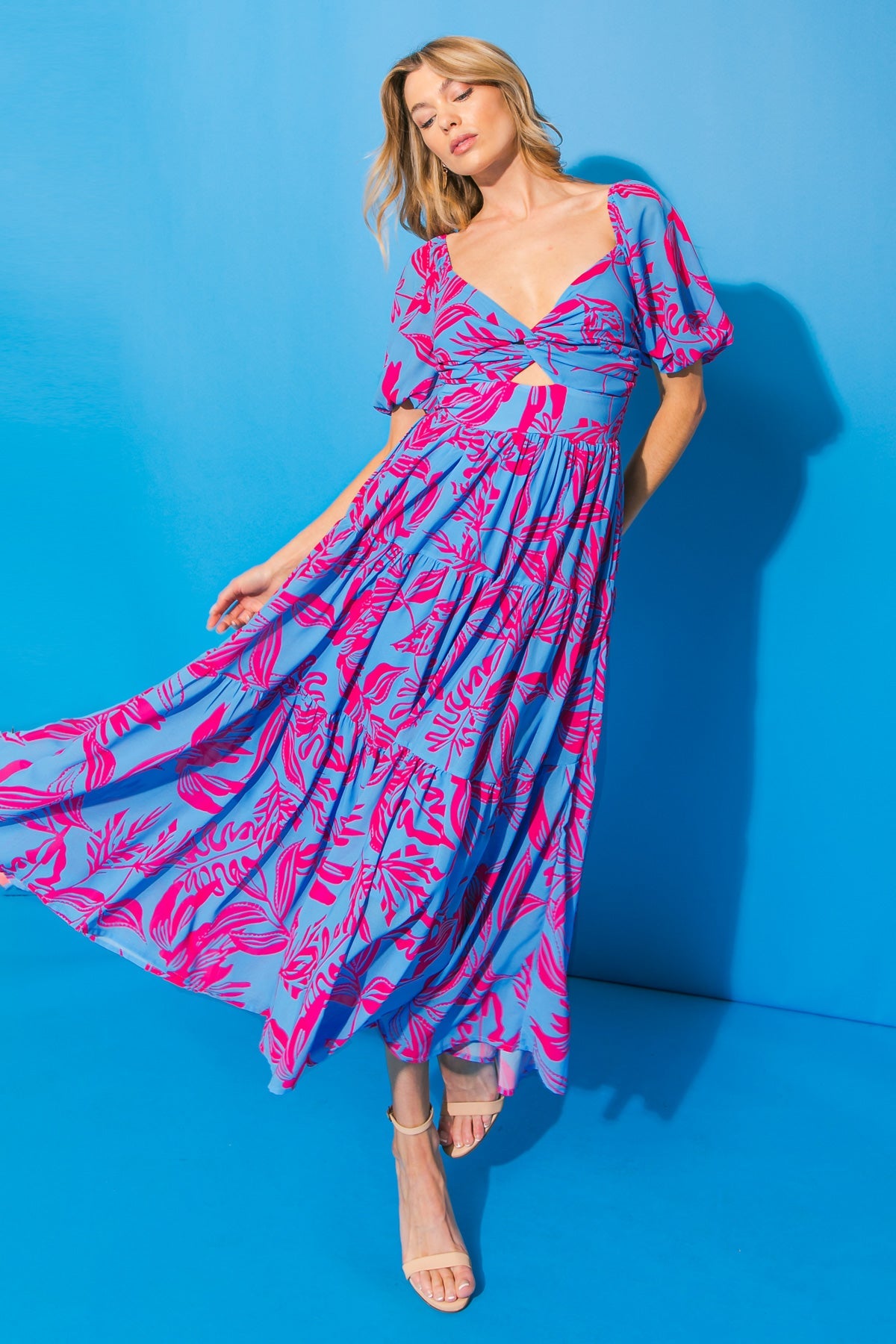 Blue and pink printed woven midi dress with sweetheart neckline and puff sleeves.