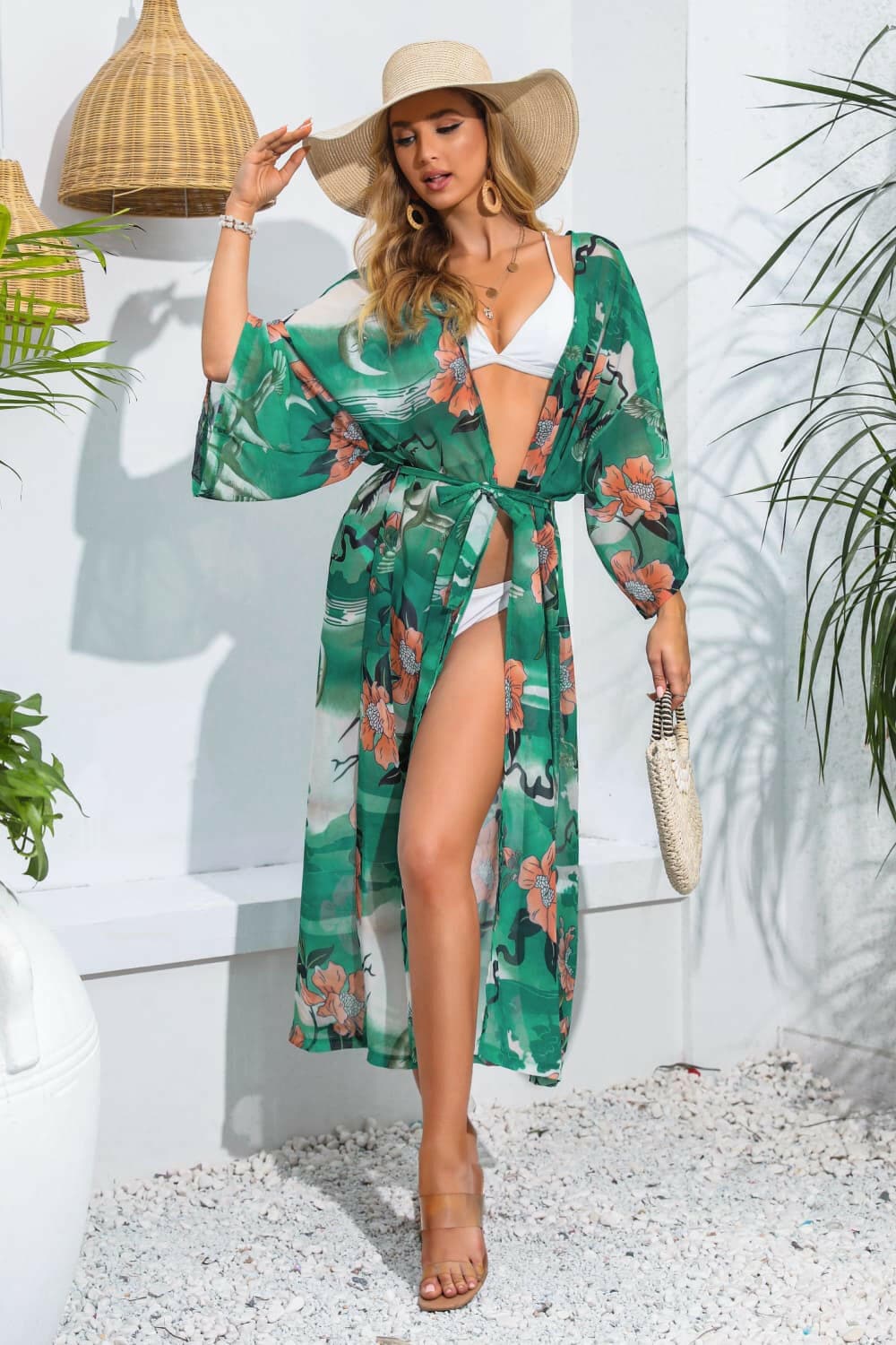 Floral tie waist beach cover-up, sheer with open front and three-quarter sleeves.