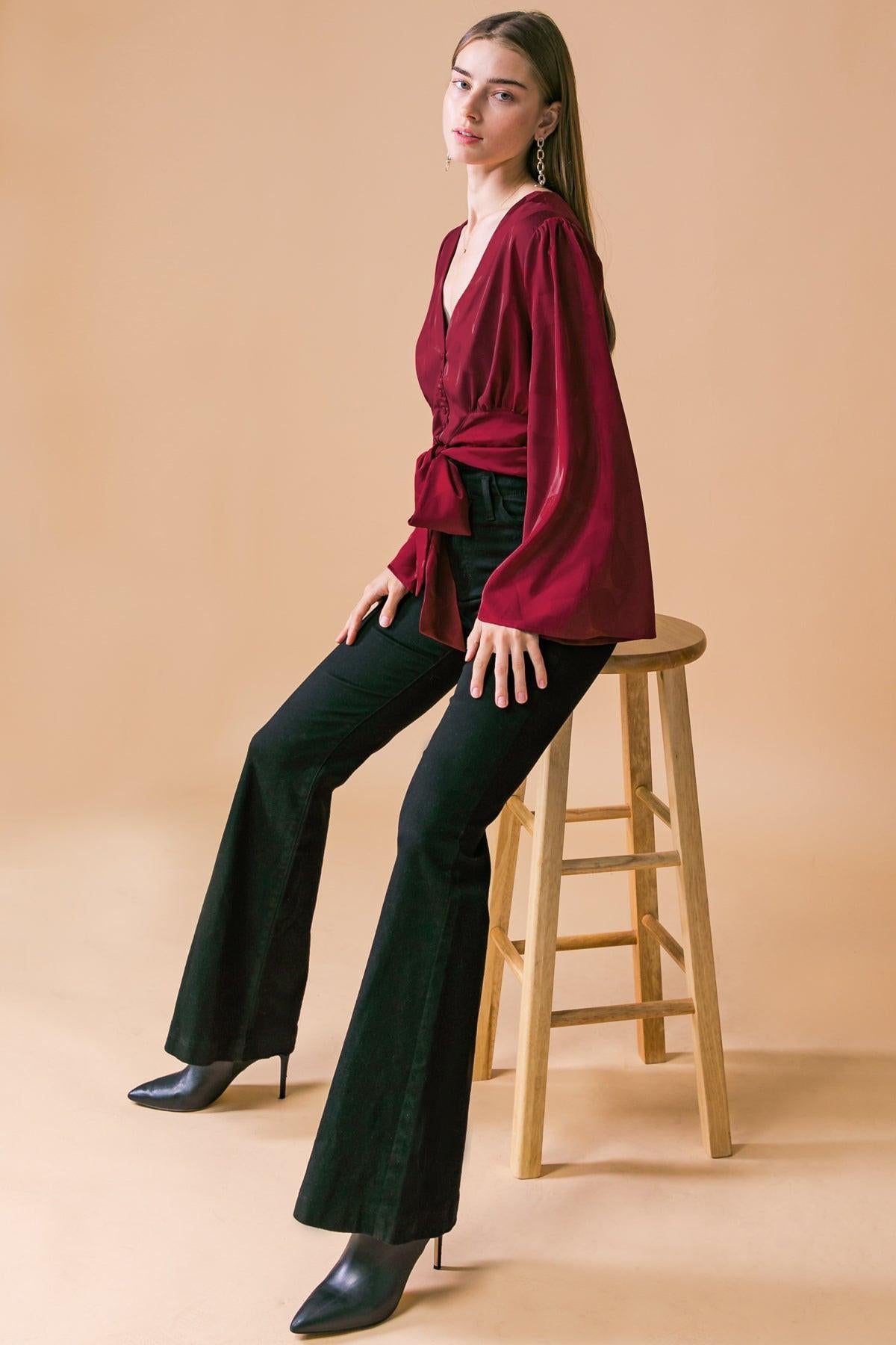 Flying Tomato THE RIGHT ADDITION WOVEN TOP styled in a chic outfit, demonstrating its versatile appeal for quality fashion.