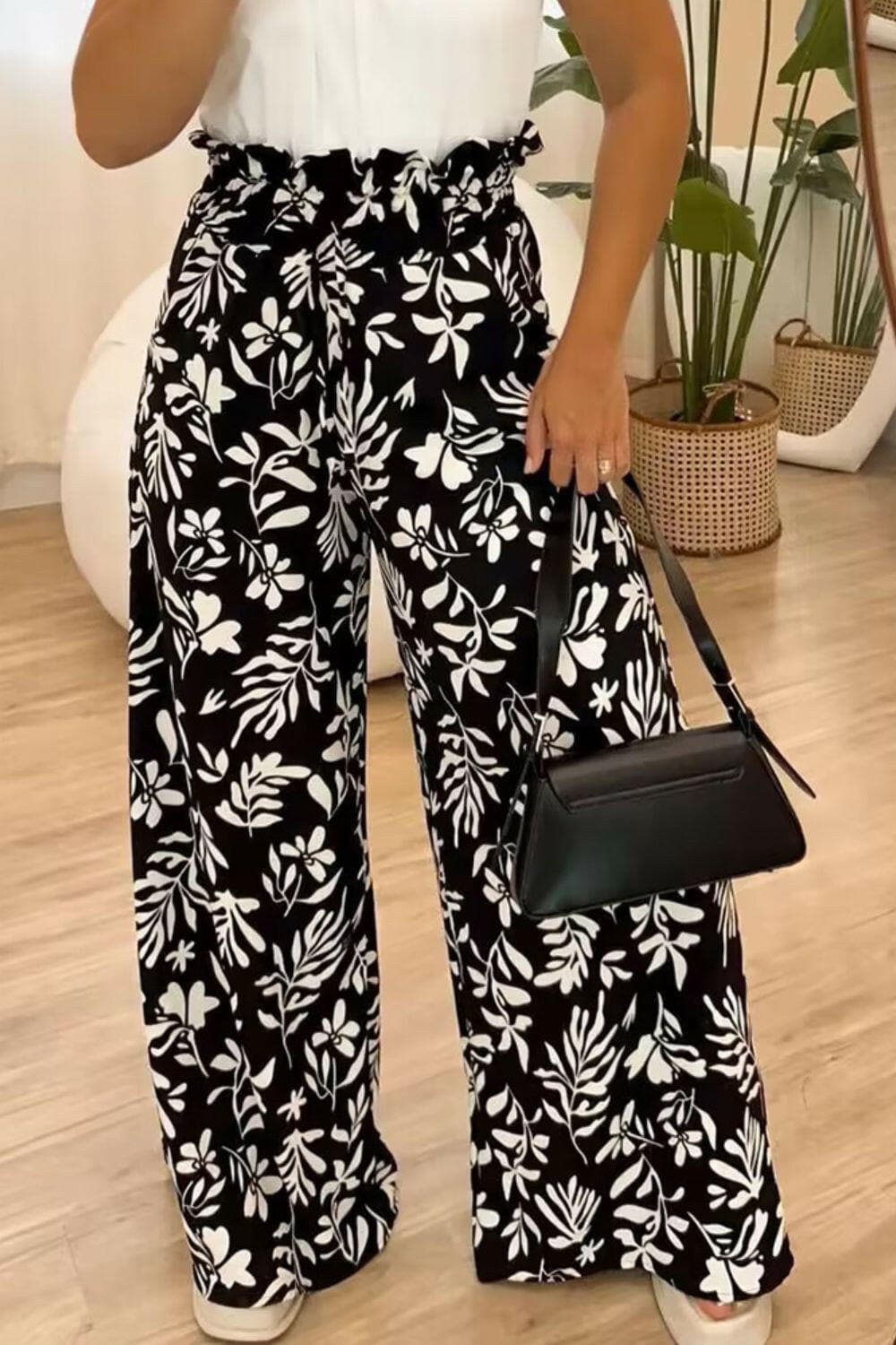 Full size patterned high waist wide leg trousers with eye-catching black and white floral design.