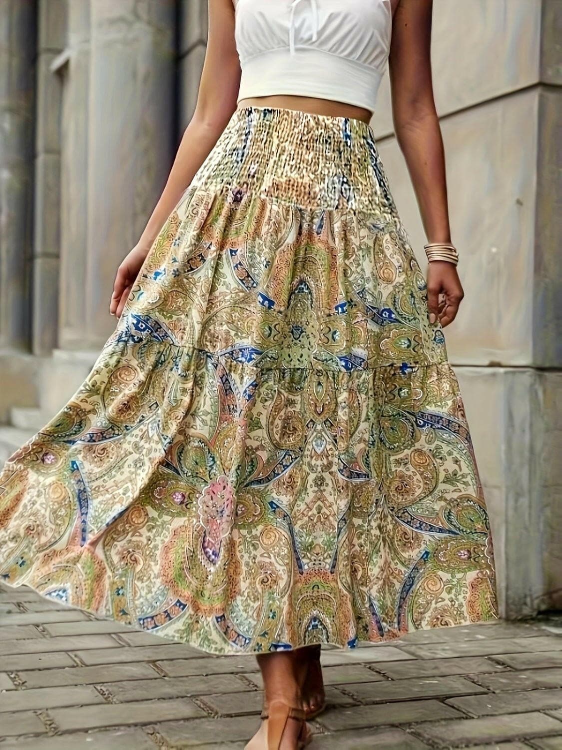 Tiered floral print high waisted maxi skirt with intricate design.