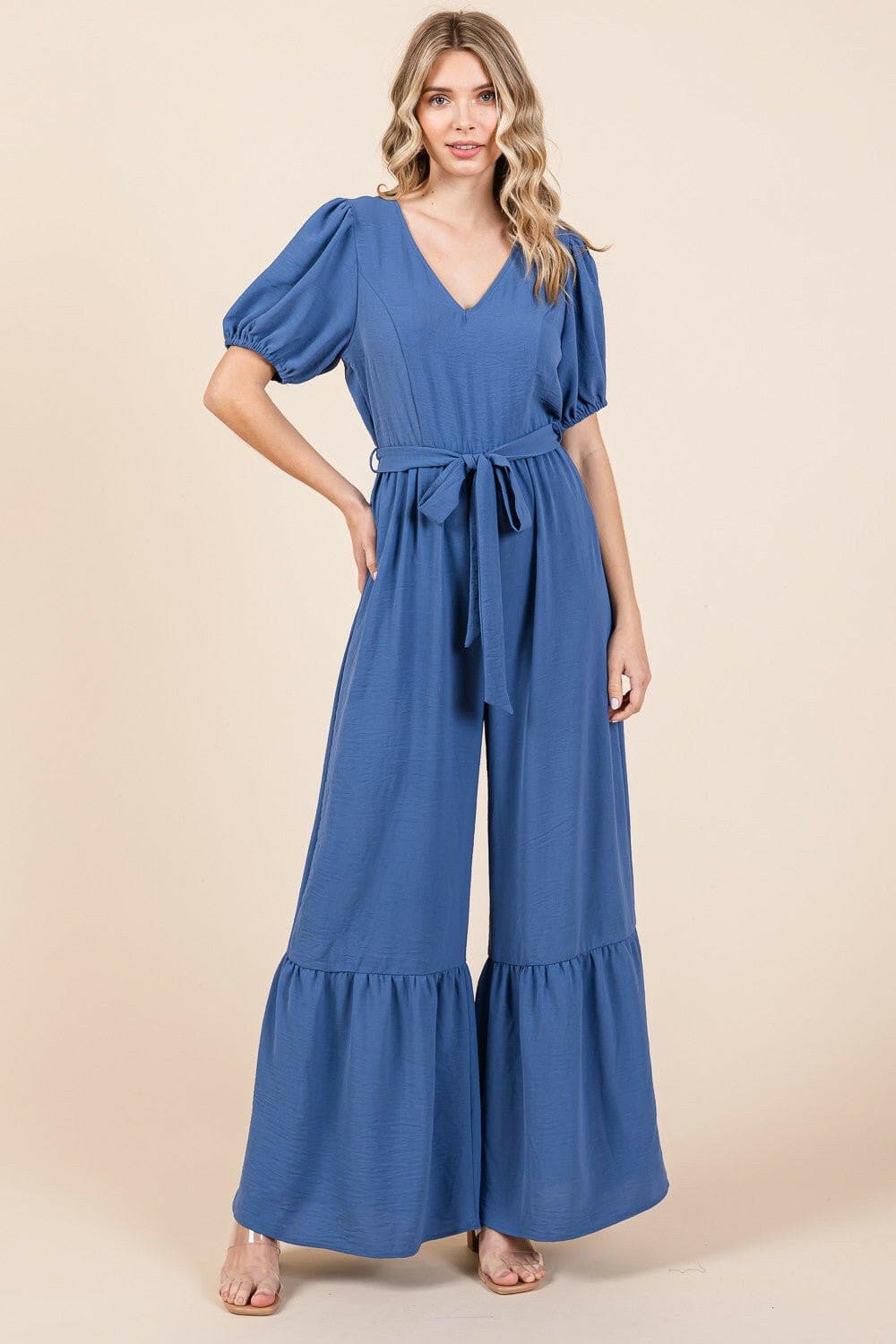 Sleek Elegance V-Neck Jumpsuit with wide leg and waist-cinching belt.