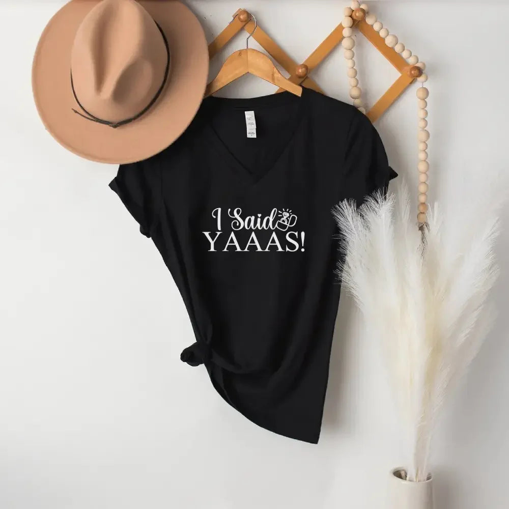 Adorb.co I Said YAAAS V-Neck T-shirts, styled with fun accessories for a vibrant bachelorette party or bridal celebration.