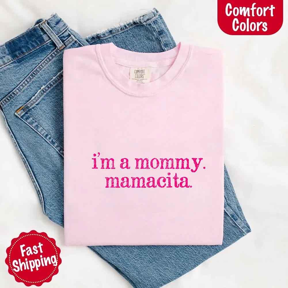 Flat lay of the Adorb Custom Tees "I'm A Mommy" Mamacita Comfort Colors shirt, highlighting its full design.
