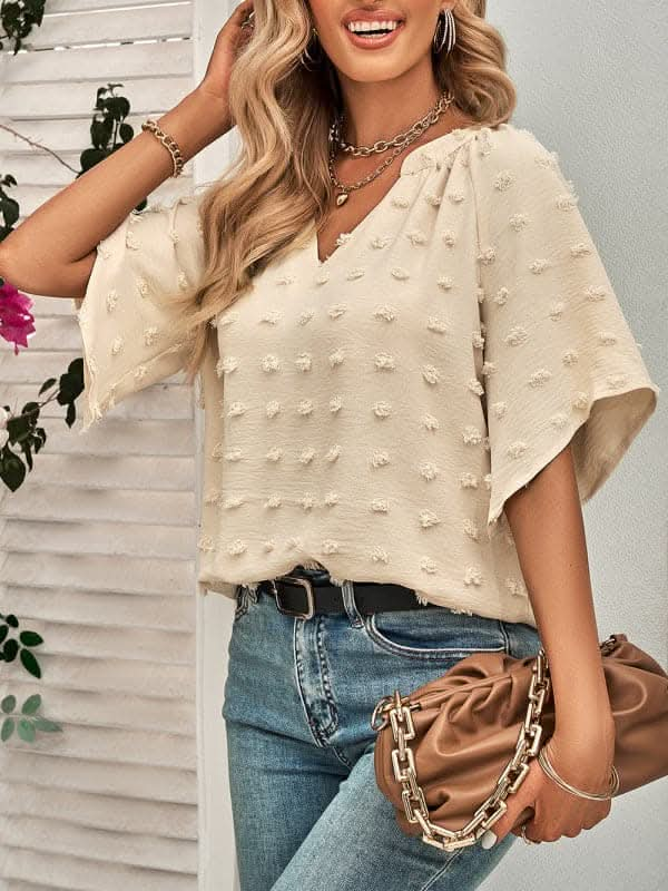 Women's casual style V-neck solid color pom pom top for women.