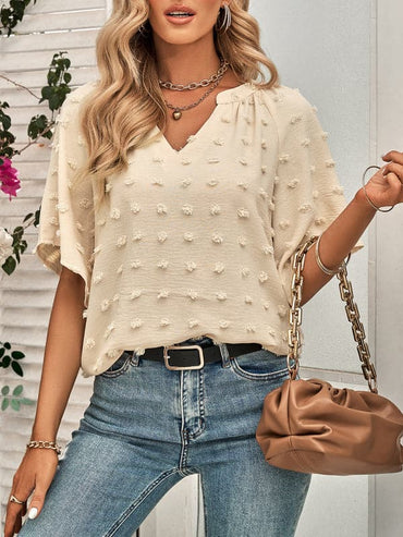 Women's casual style V-neck solid color pom pom top for women.