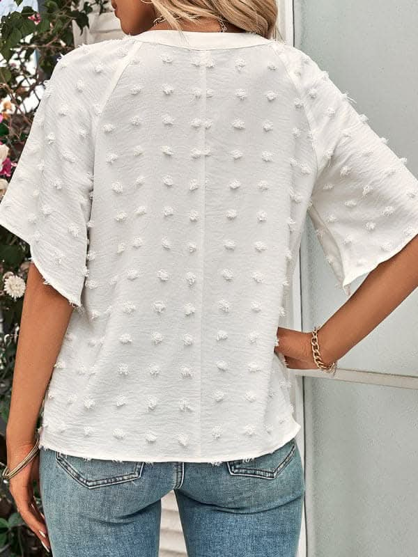 Women's casual style V-neck solid color pom pom top for women.