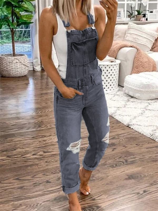 Women's casual ripped denim jumpsuit with double shoulder suspenders and pockets.