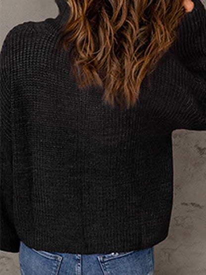 Women's zippered loose turtleneck long sleeve pullover sweater.