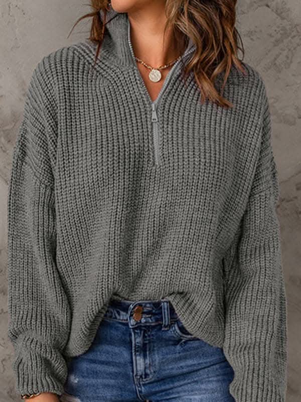 Women's zippered loose turtleneck long sleeve pullover sweater.