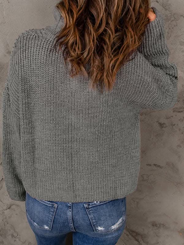 Women's zippered loose turtleneck long sleeve pullover sweater.