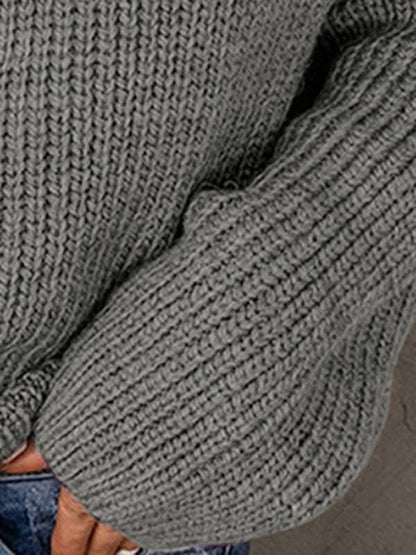 Women's zippered loose turtleneck long sleeve pullover sweater.
