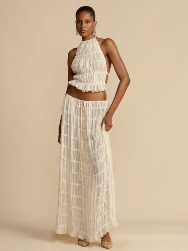 Backless lace-up halter top set and two-piece chiffon pleated long skirt with earrings.
