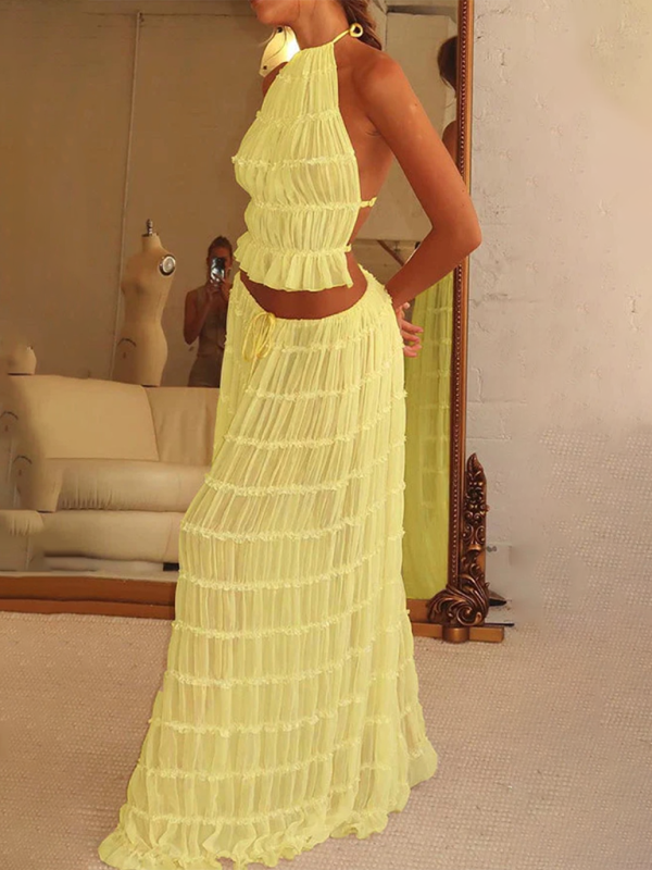 Backless lace-up halter top set and two-piece chiffon pleated long skirt with earrings.