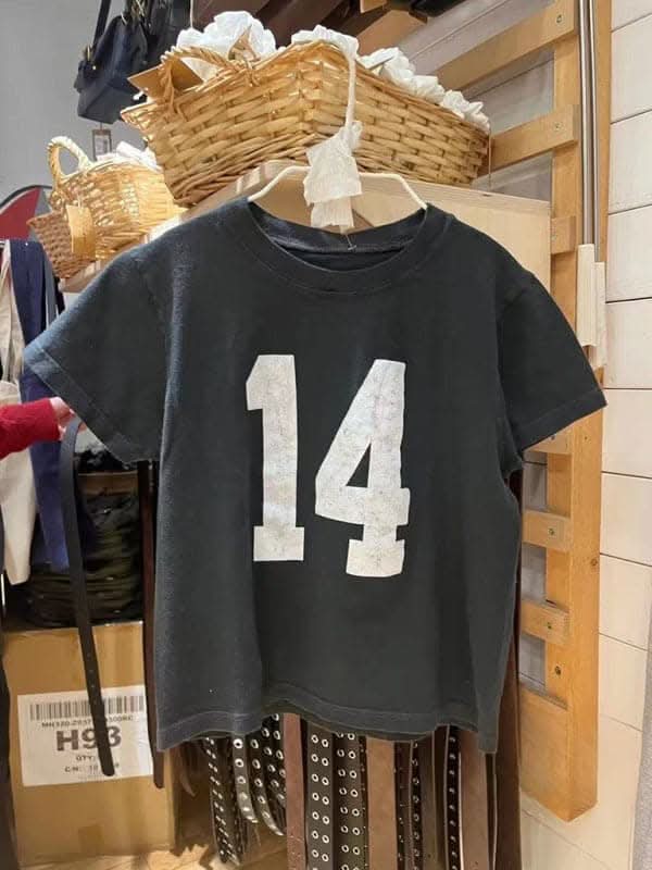Trendy high-waisted distressed tee