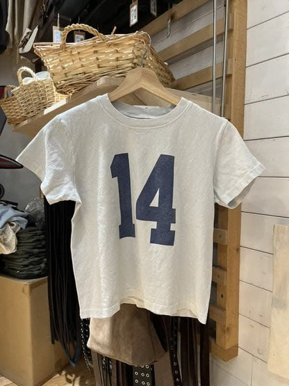 Trendy high-waisted distressed tee